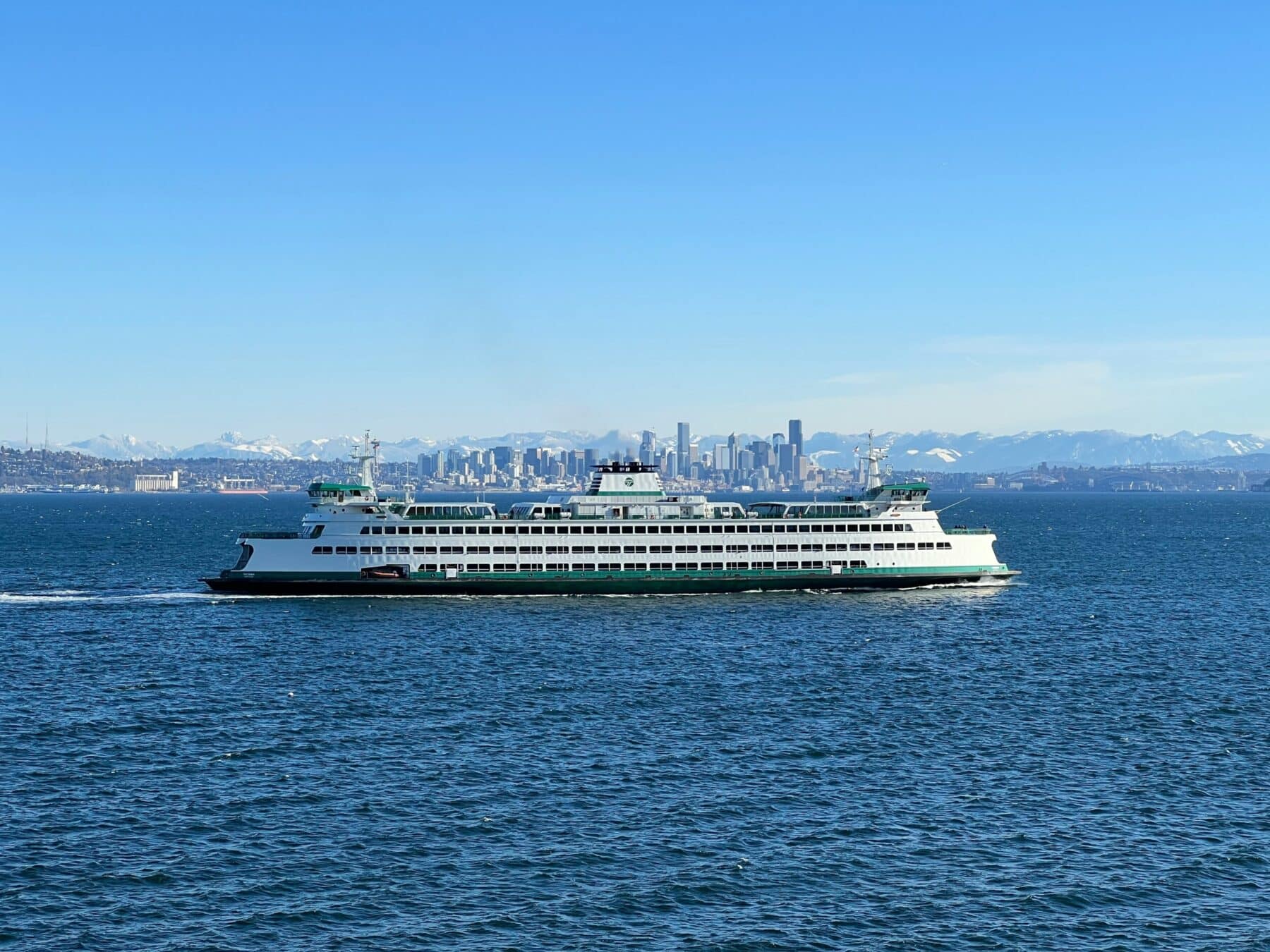 Washington State ferry crossing Elliott Bay with the Seattle skyline in the background